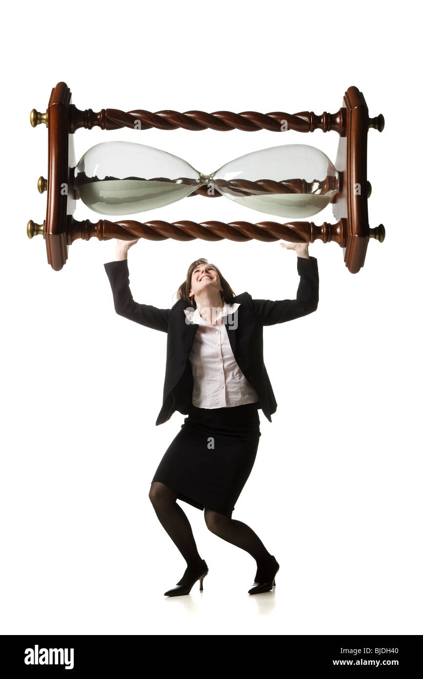 businessperson holding up an hourglass Stock Photo