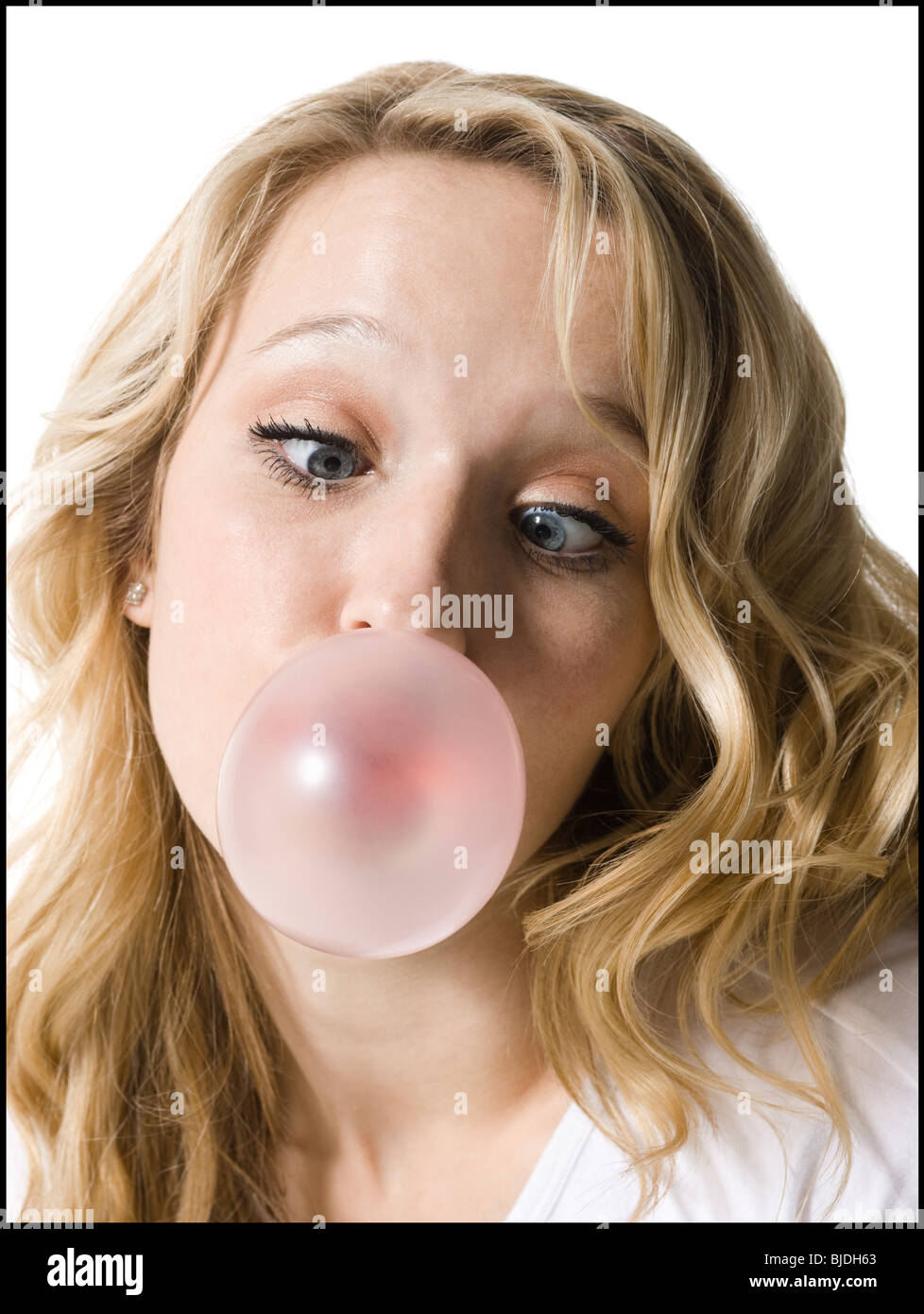young woman chewing bubble gum Stock Photo