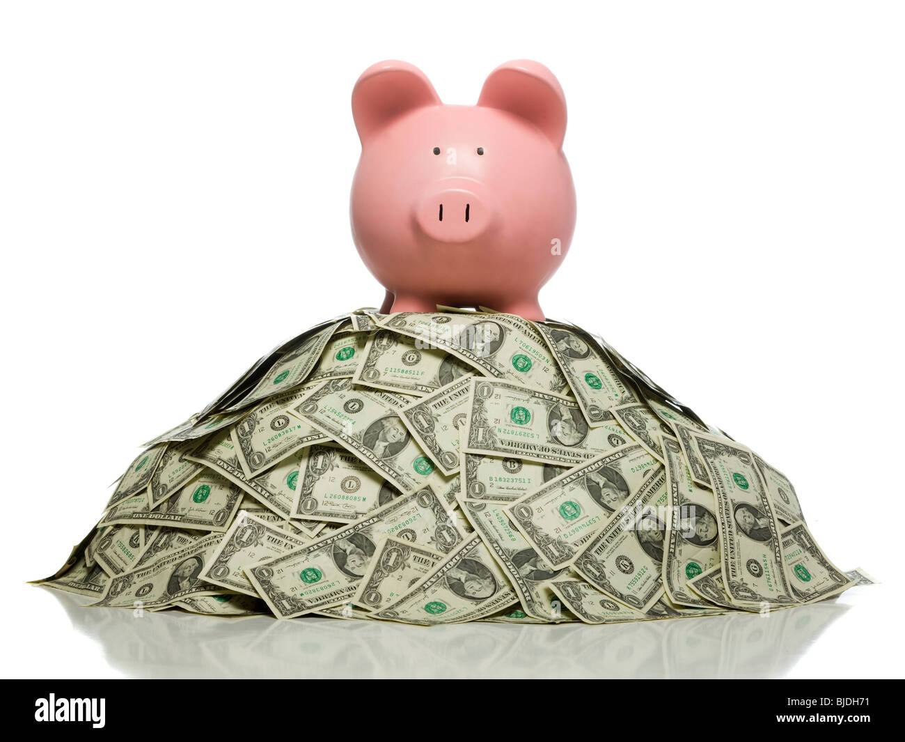 piggy bank on a pile of money Stock Photo