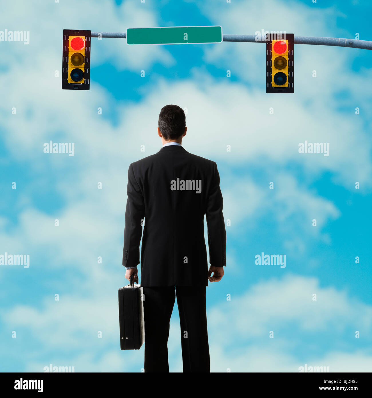 businessperson standing at a traffic signal Stock Photo Alamy
