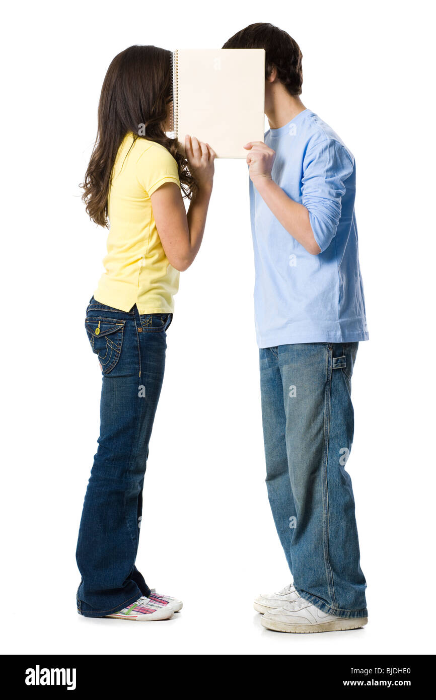 young couple holding a sign Stock Photo