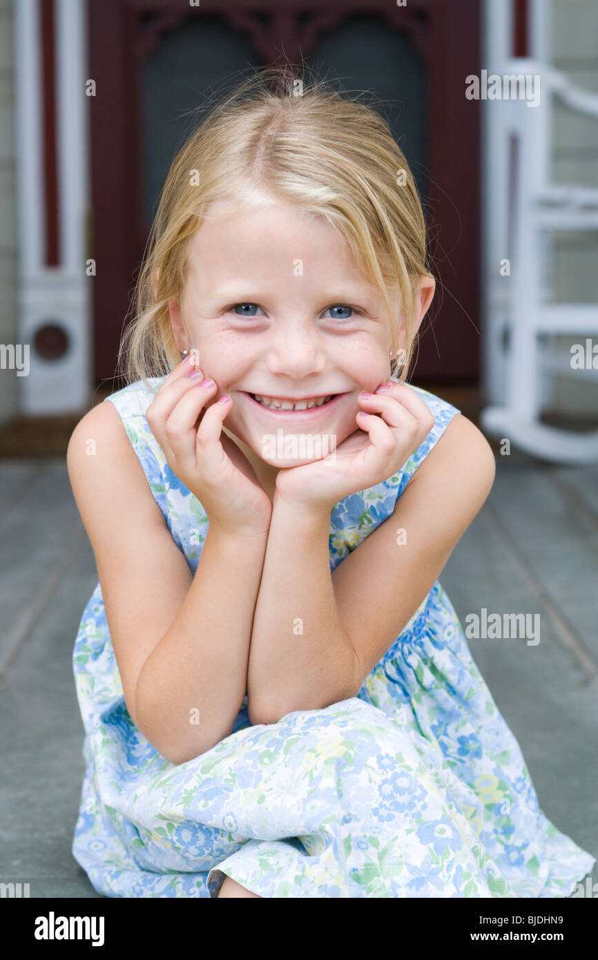 girl sitting on the front porch Stock Photo - Alamy