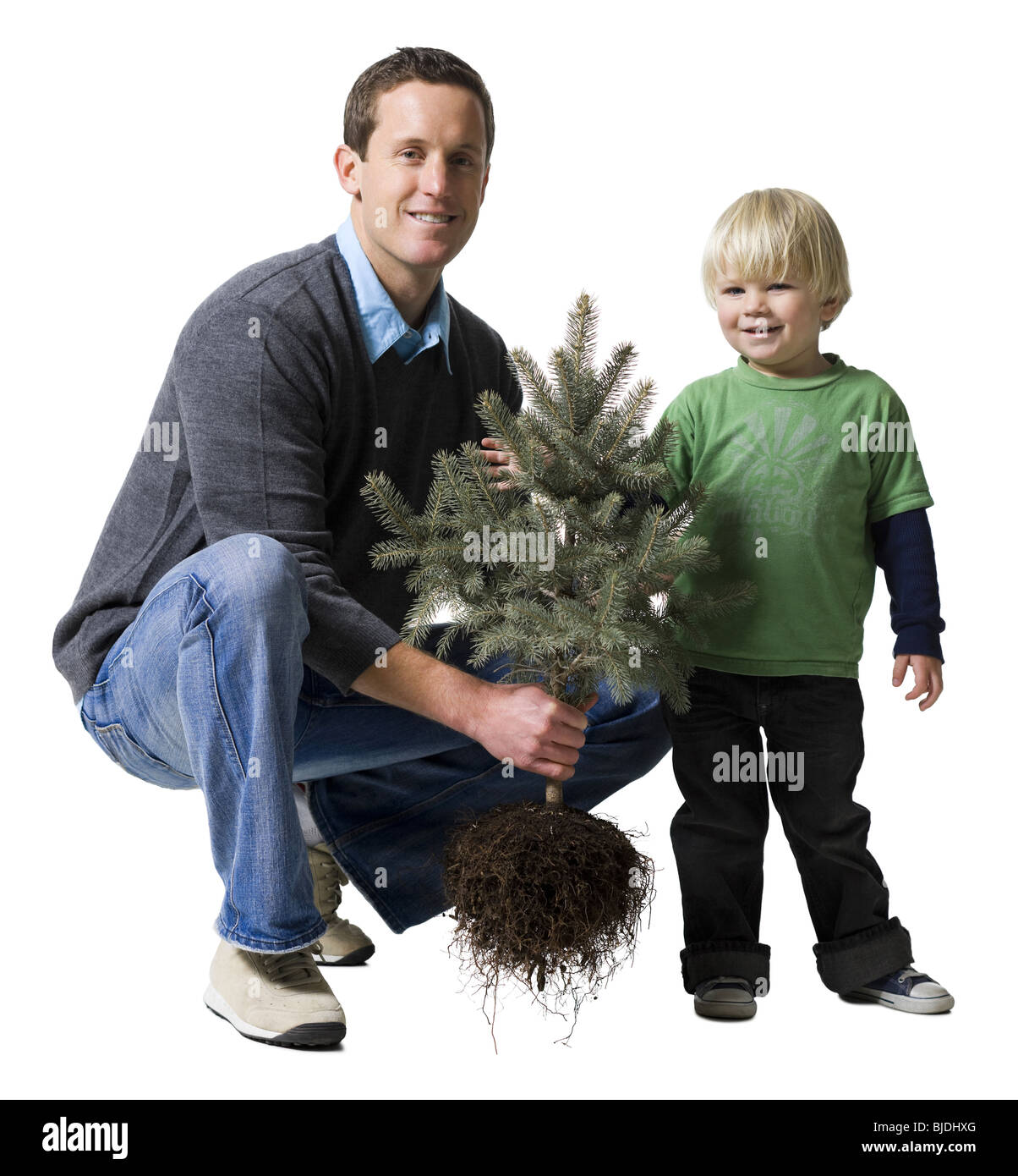 father and son with a tree Stock Photo