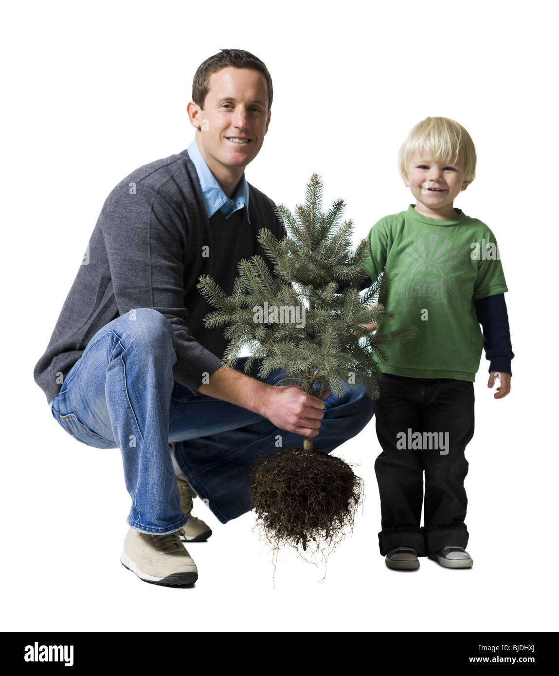 father and son with a tree Stock Photo