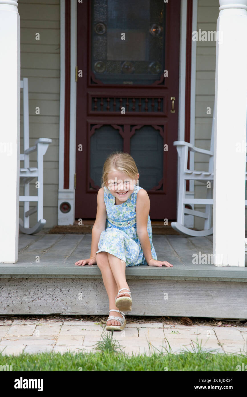 girl sitting on the front porch Stock Photo - Alamy