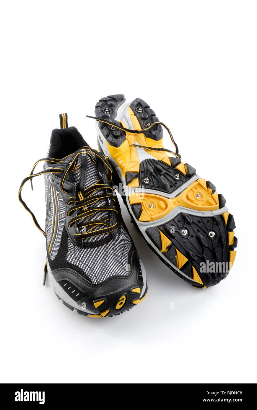 https://c8.alamy.com/comp/BJDNC8/water-proof-running-shoes-with-spikes-for-traction-on-snow-and-ice-BJDNC8.jpg