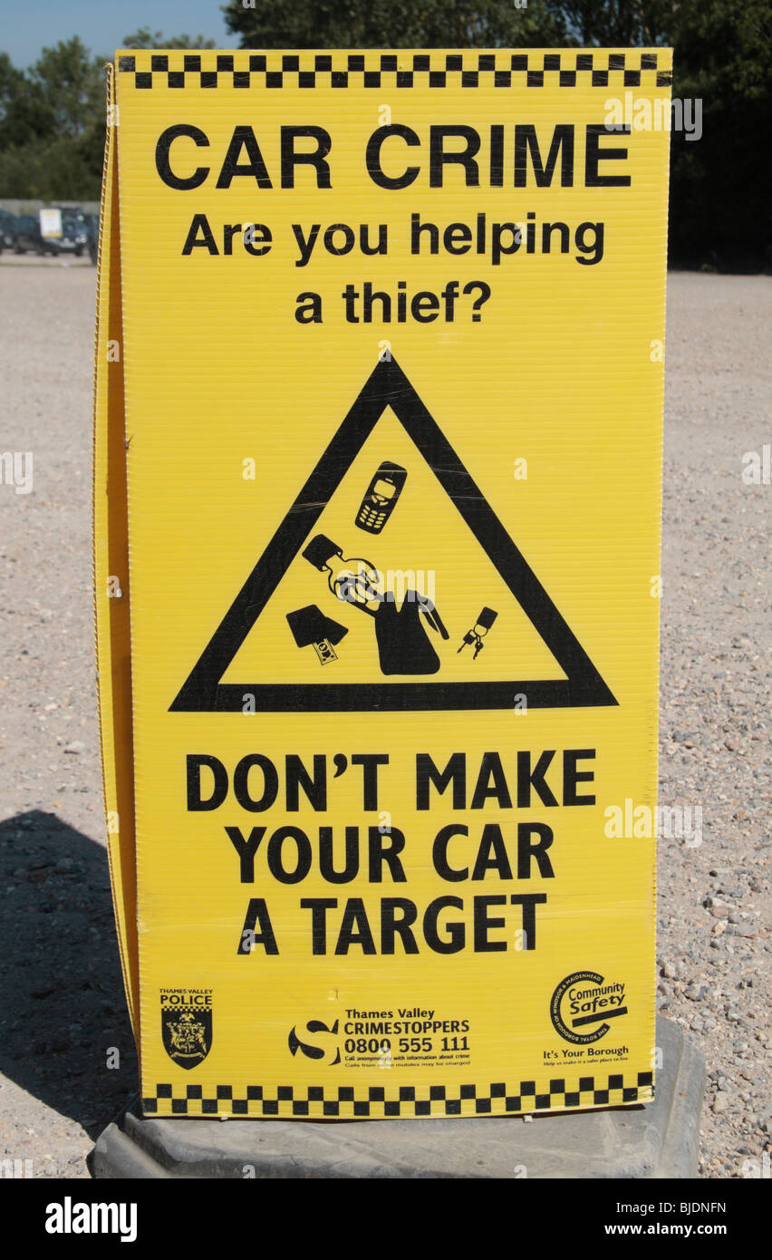 A car park sign, from the Thames Valley Police, warning drivers about protecting their possessions. Stock Photo