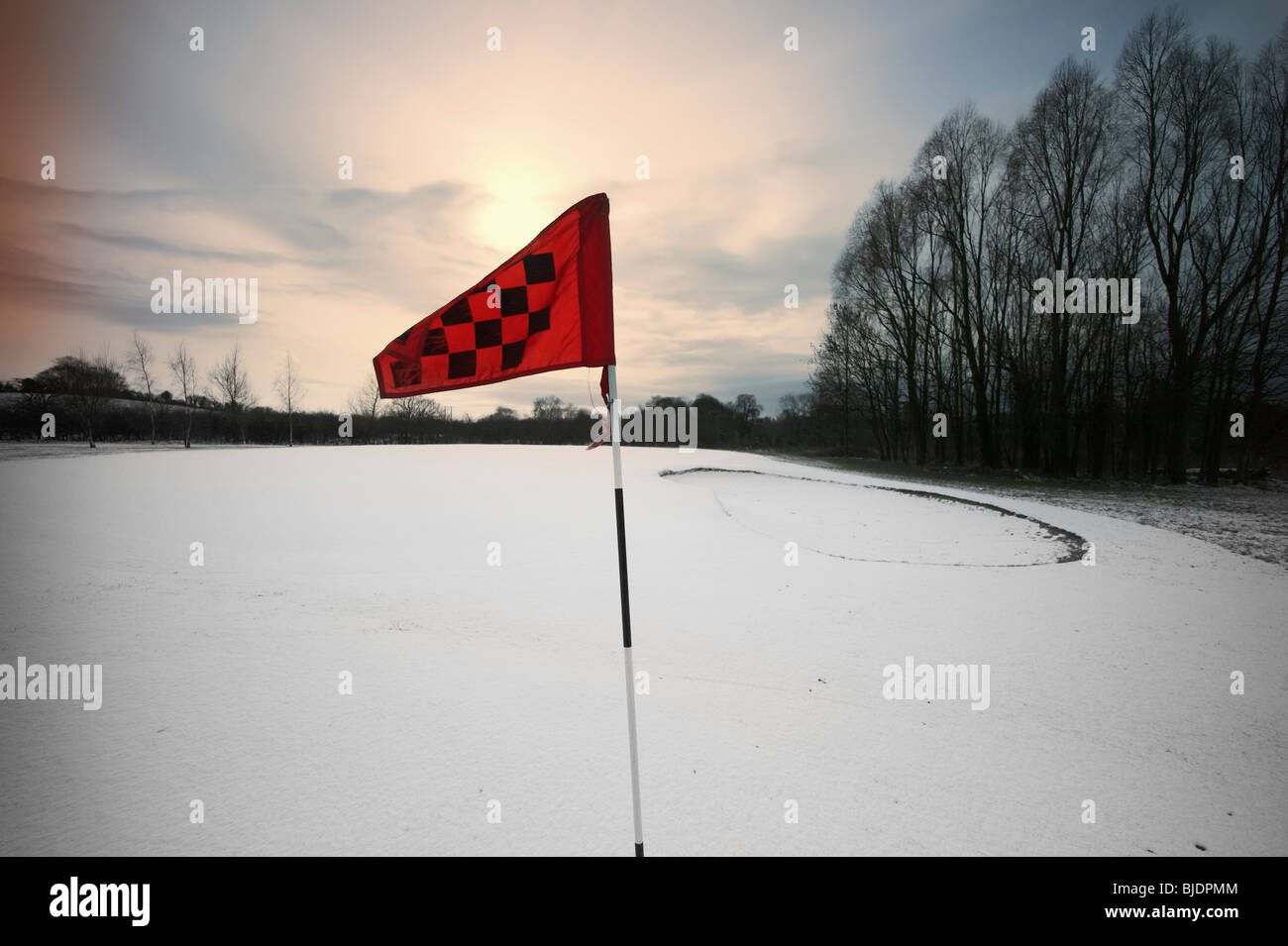 golf course snow winter hole flag Stock Photo - Alamy