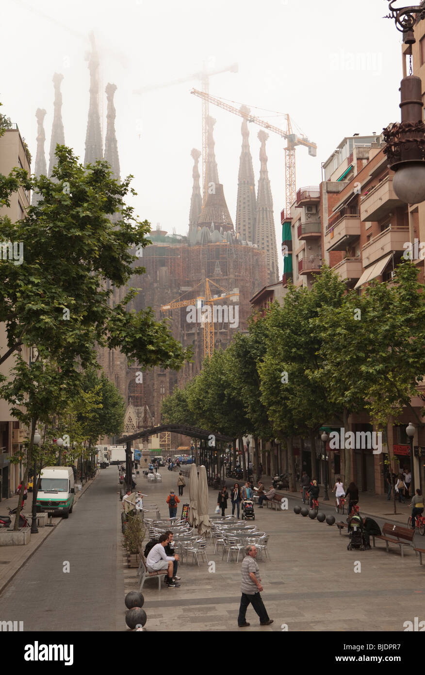 Sagrada Familia Street View Sagrada Familia From Top Of Tourist Busl Barcelona, Misty View Of Cranes  Working Overhead And Street Scene Below Stock Photo - Alamy