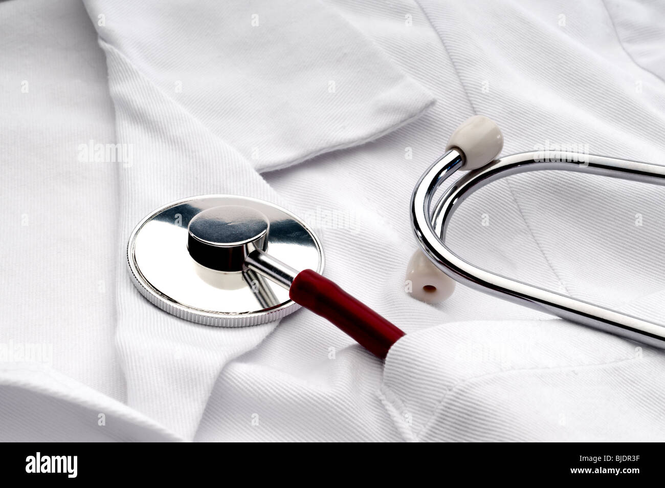 Close up of a stethoscope in a pocket of a doctor's white lab coat Stock Photo
