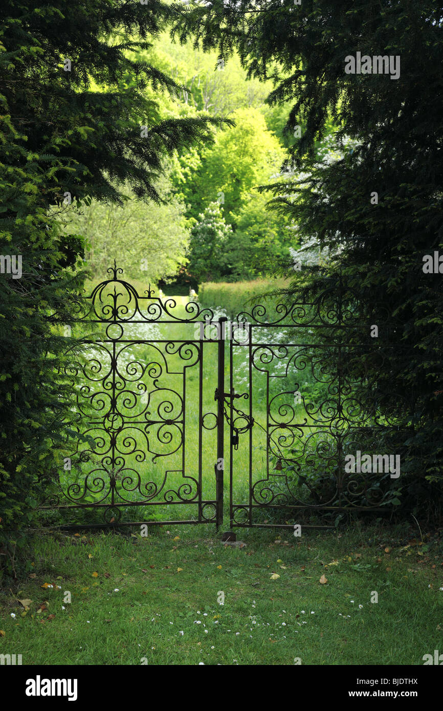 Decorative wrought iron garden gates locked Stock Photo