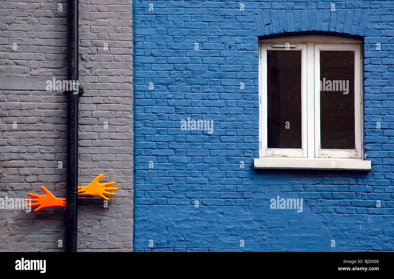 Plastic hands on brick walls in Southwark London England UK Stock Photo
