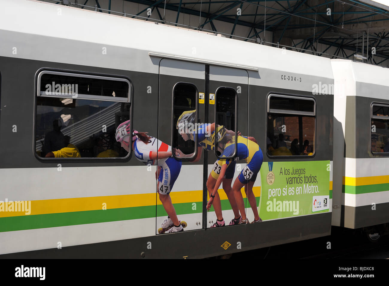 Metro with painted pictures of 3 young women athletes to promote the 2010 South American Games in Medellin. Stock Photo