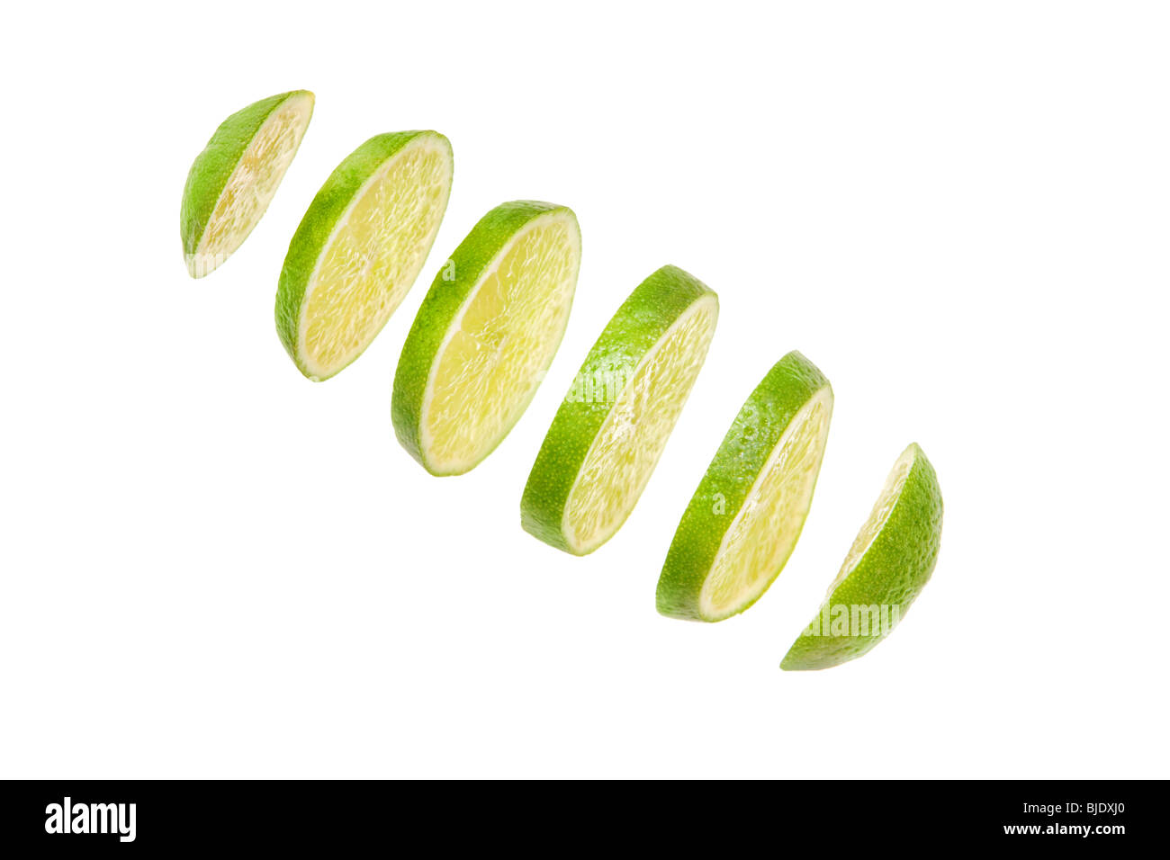 lime in sclices on a white background Stock Photo