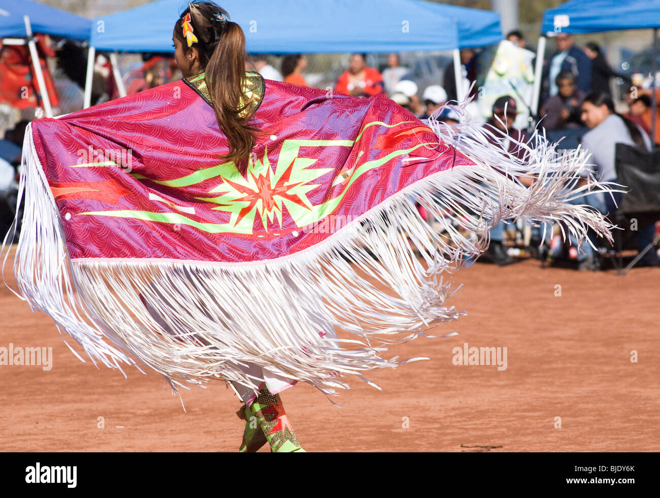 Native American dancers in traditional regalia perform during a Pow Wow. Stock Photo