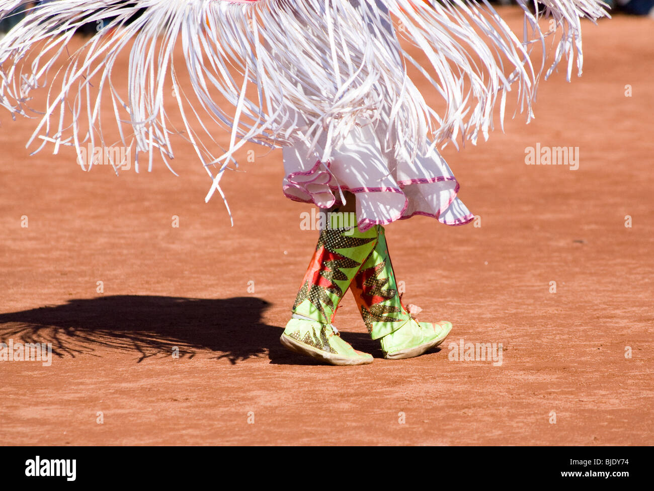 Native American dancers in traditional regalia perform during a Pow Wow. Stock Photo