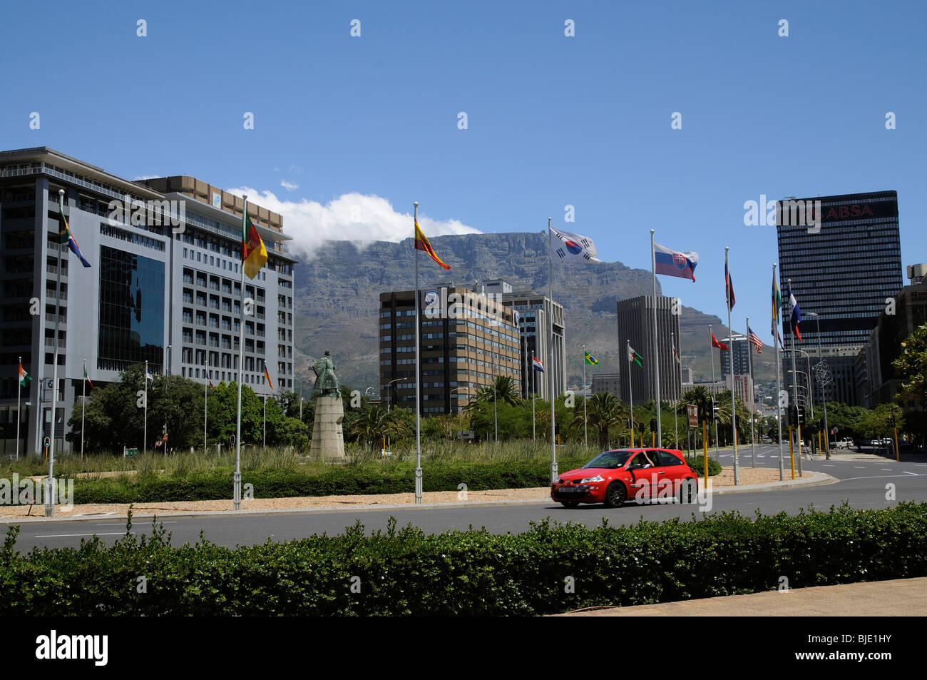 Table Mountain with cloud gathering overlooks the office premises along Adderley Street in Cape Town's city centre. South Africa Stock Photo