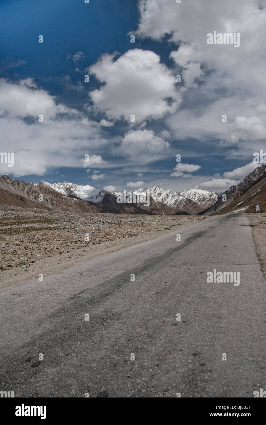 View of an Empty road in the Town of Jelandy, Pamir highway, Tajikistan. Stock Photo