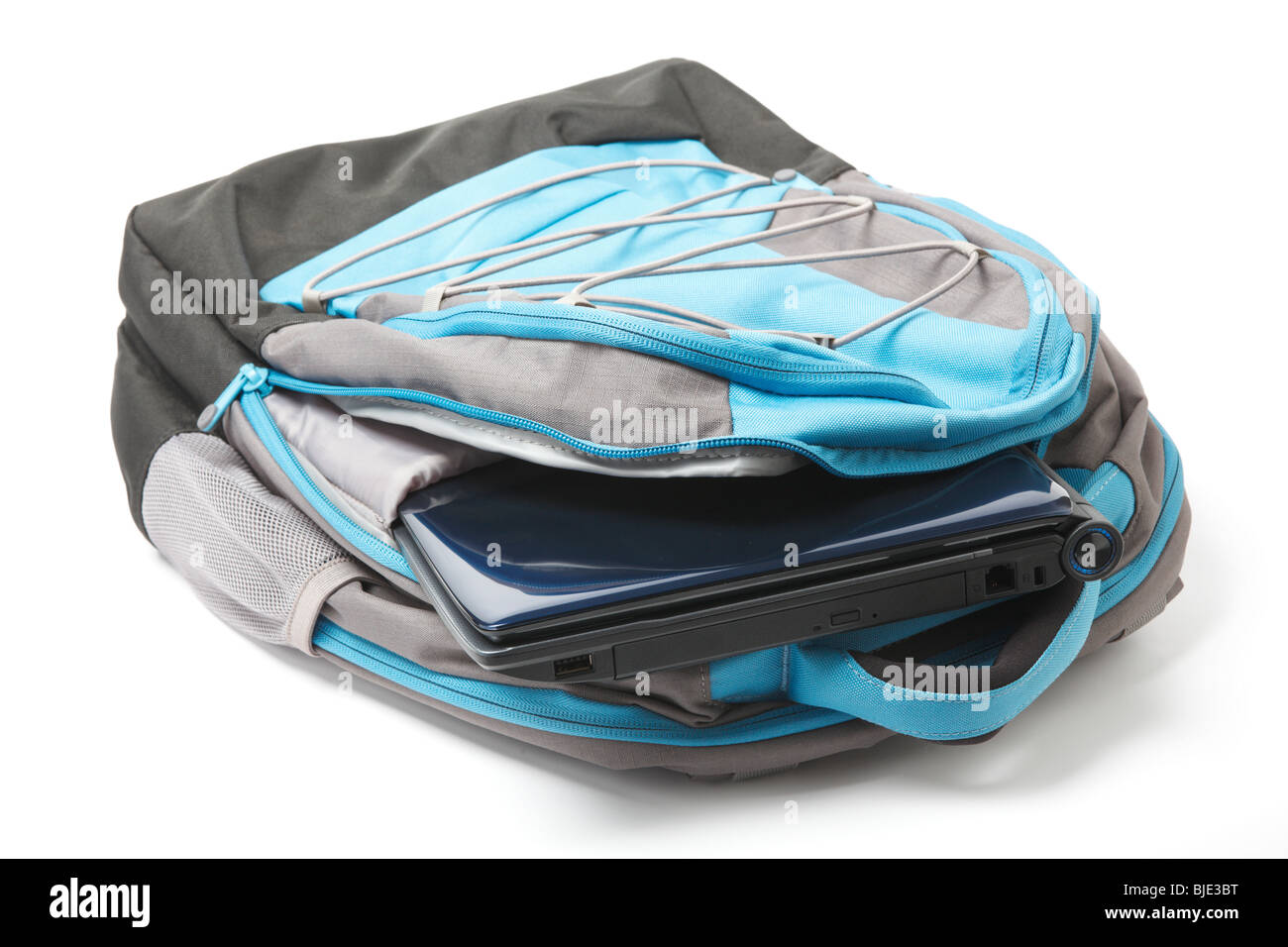 Backpack with a laptop inside isolated on white background Stock Photo