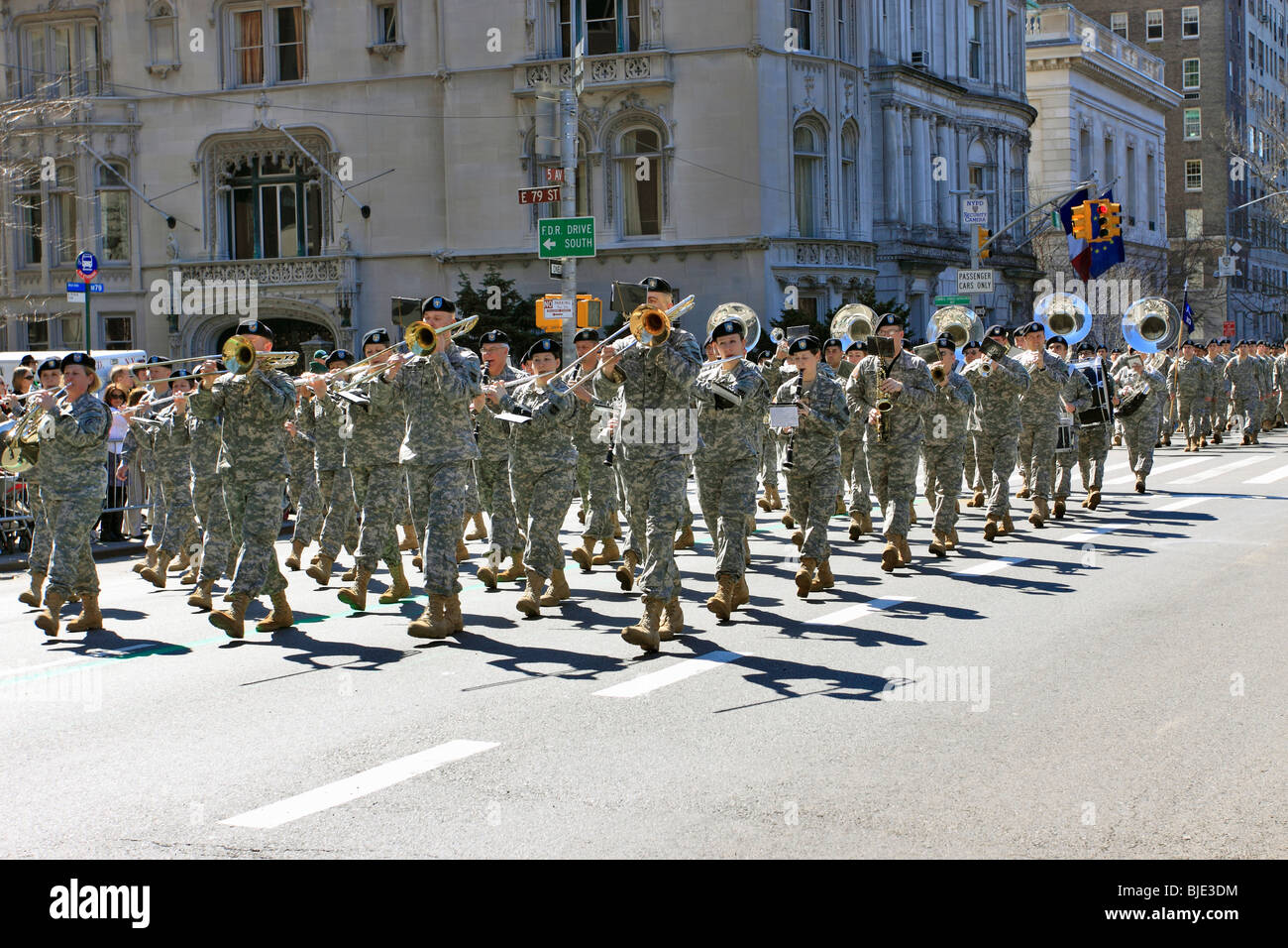 Military marching band marches up 5th Ave. in St. Patrick's Day parade, Manhattan, New York City Stock Photo