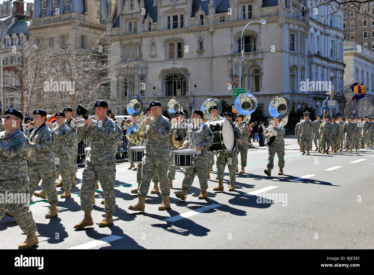 Military marching band marches up 5th Ave. in St. Patrick's Day parade, 5th Ave., Manhattan, New York City Stock Photo