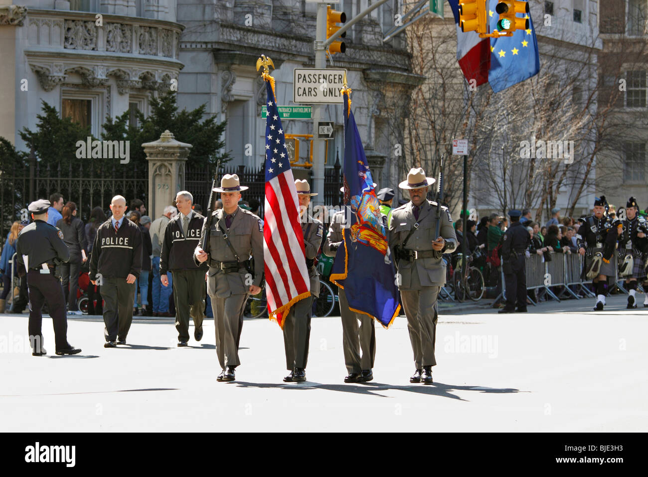 New York State Troopers color guard leads their pipes and drum band up 5th Ave. in New York City's St. Patrick's Day parade. Stock Photo