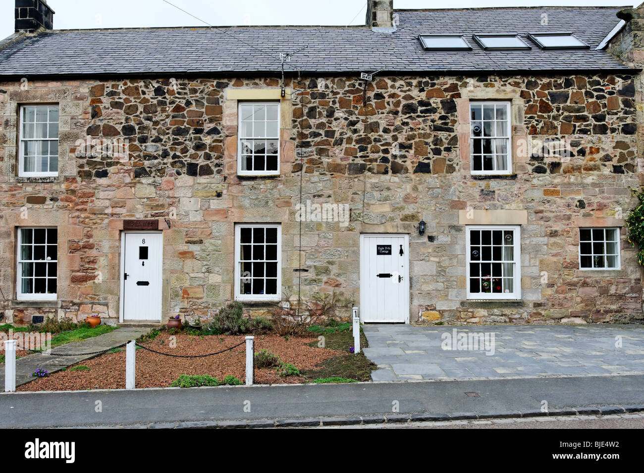 Stone Cottages In The Northumberland Coastal Village Of Bamburgh