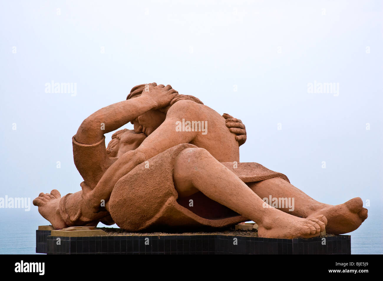 A clay statue of a man kissing a woman (The Monument to Love) in the Miraflores district in Lima, Peru. Stock Photo