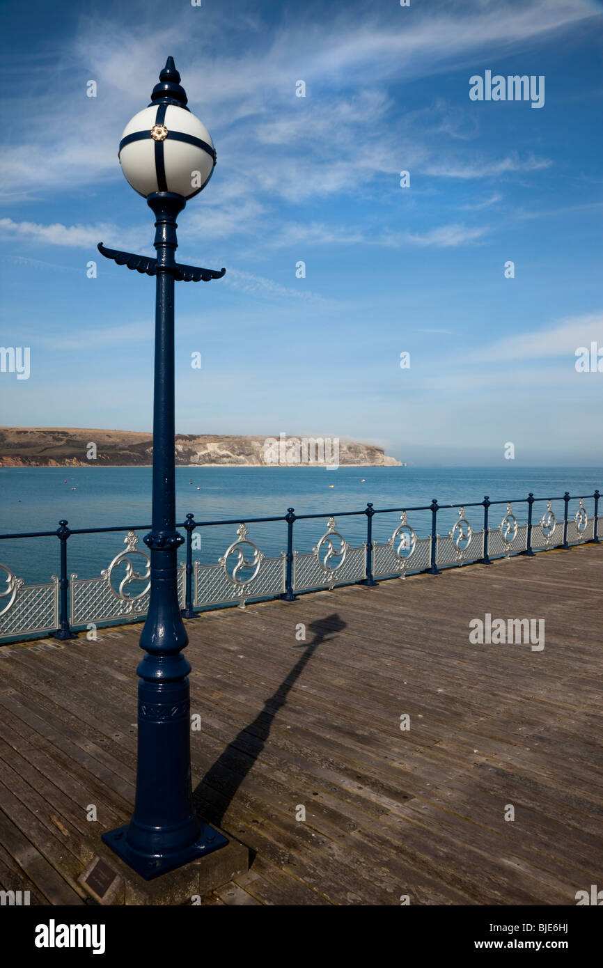 Swanage Pier shadow pointing to Old Harry Rocks Stock Photo