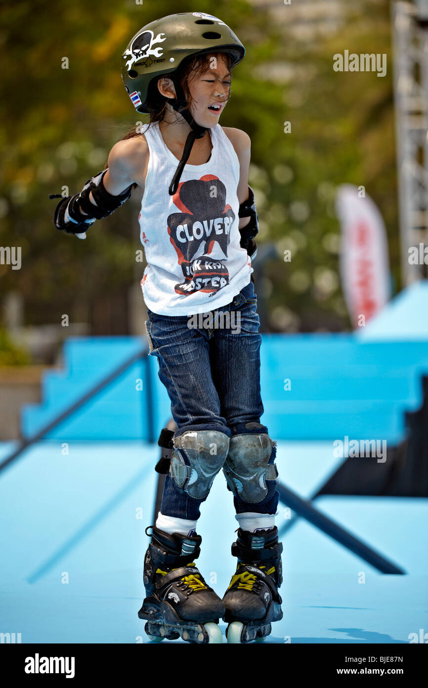 Young Asian child roller skating with full protective equipment. Thailand  S. E. Asia Stock Photo - Alamy