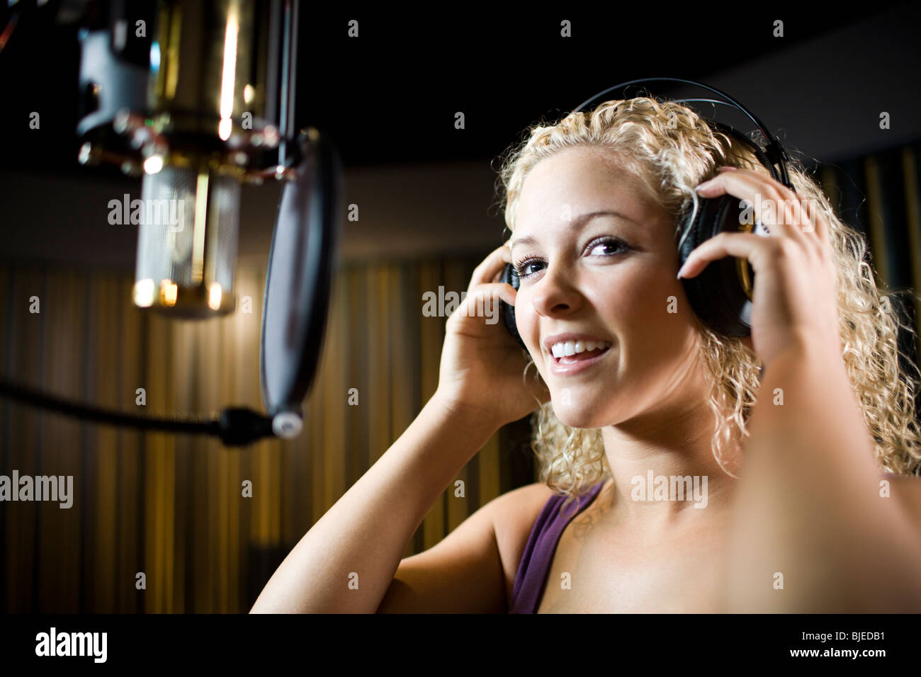 singing in a recording studio Stock Photo