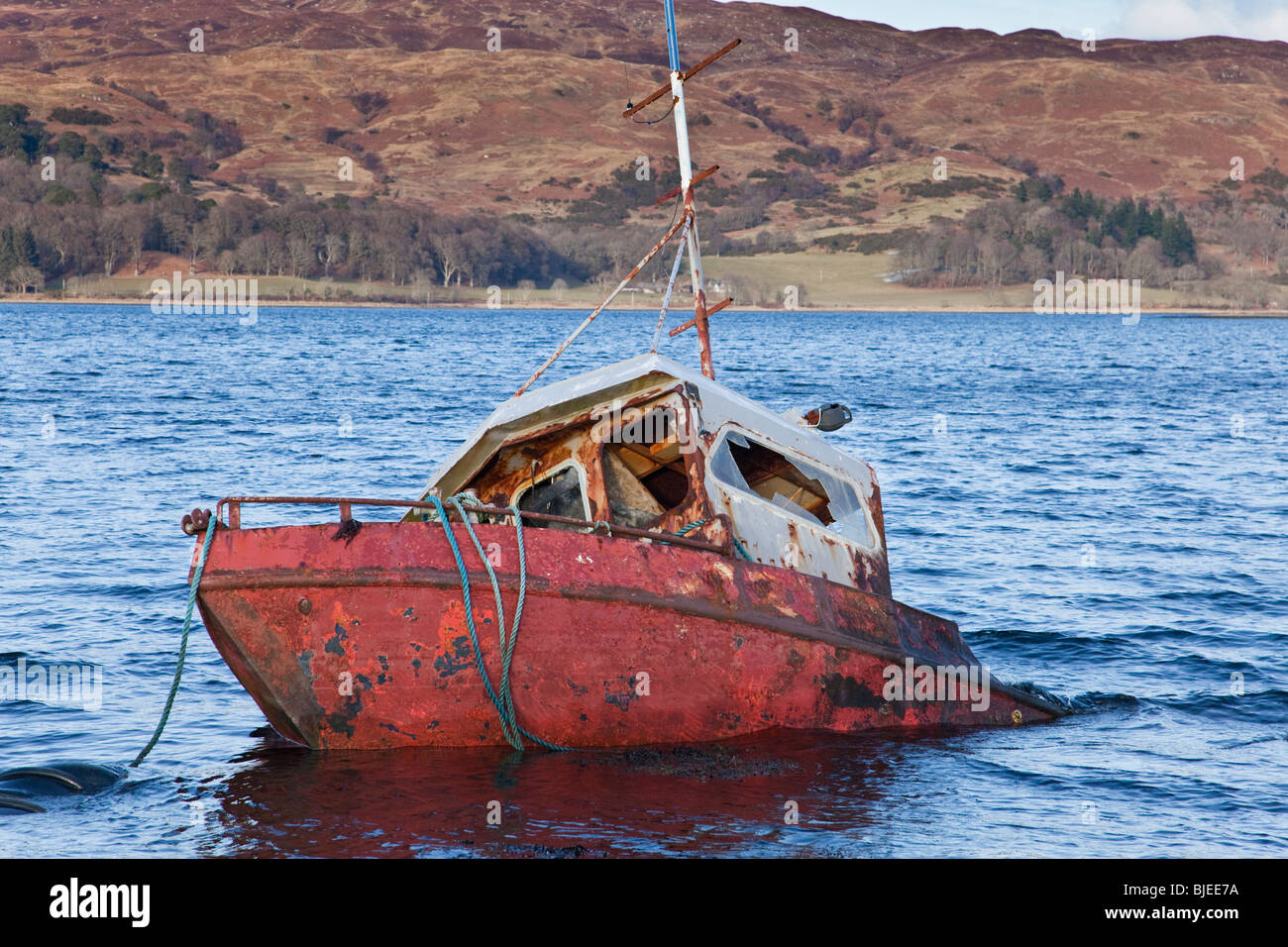 half-sunken-wreck-of-fishing-boat-on-loch-etive-BJEE7A.jpg