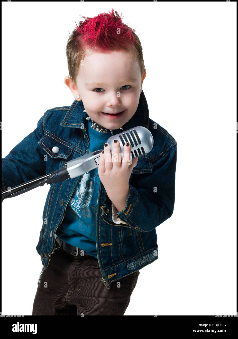 little boy singing into a microphone Stock Photo Alamy