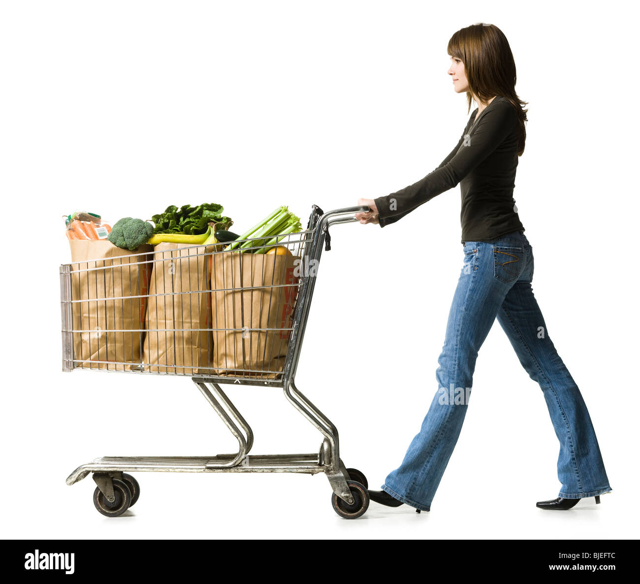 woman pushing a shopping cart Stock Photo
