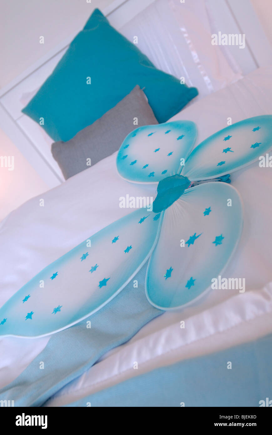 Blue fabric butterfly decor feature in a child's bedroom Stock Photo