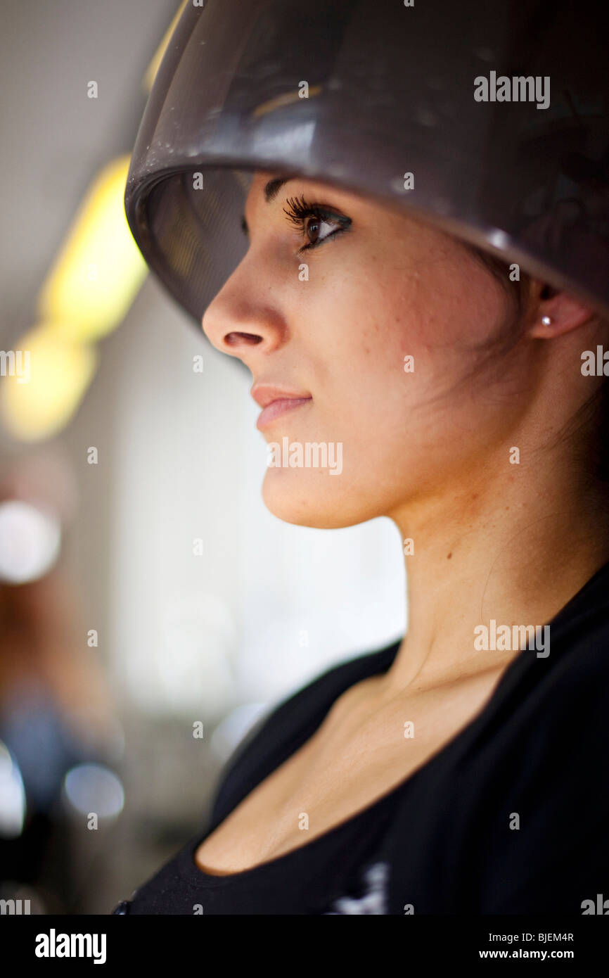 Young woman under drying hood in hair salon Stock Photo Alamy