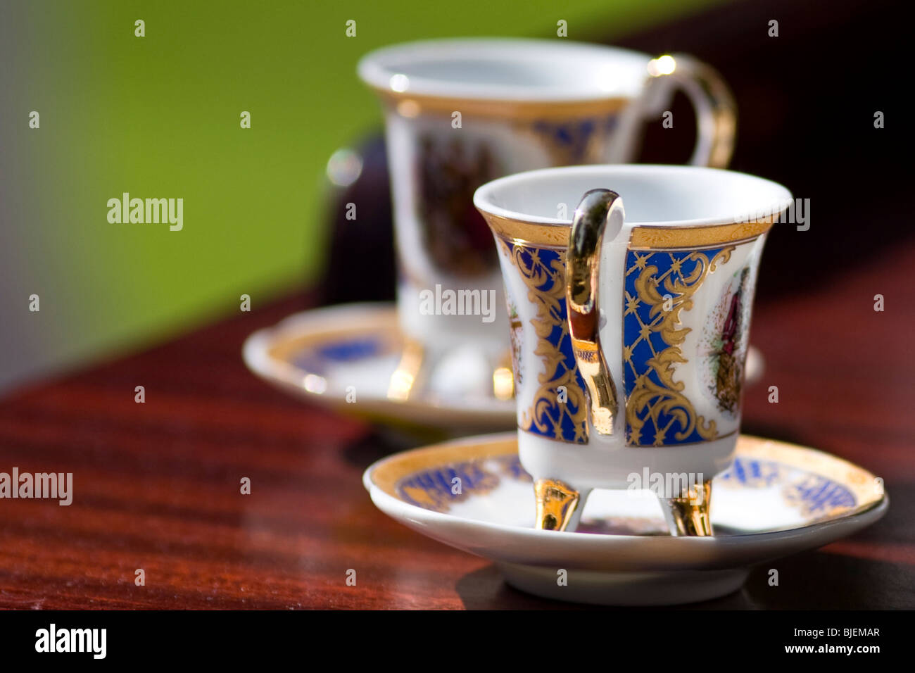 https://c8.alamy.com/comp/BJEMAR/two-tea-cups-on-a-table-close-up-BJEMAR.jpg
