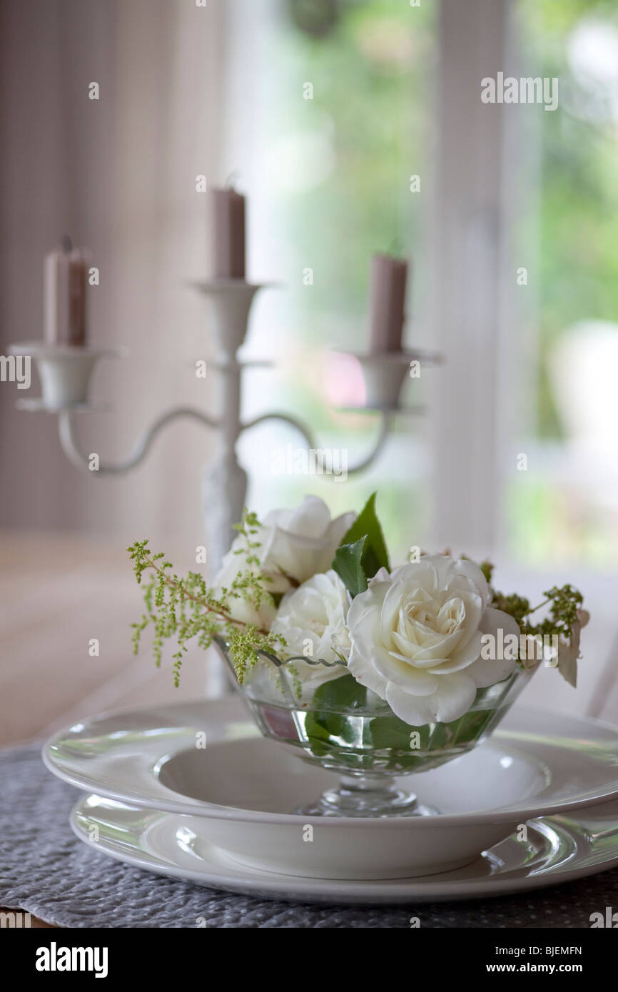 Table decoration with candleholder and white roses, Ramsen, Switzerland, close-up Stock Photo