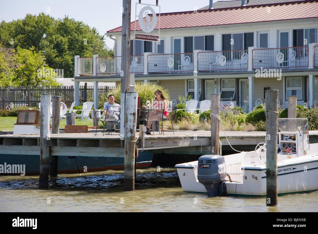 Guests enjoy cocktails and sunshine by the water at the Tilghman Island