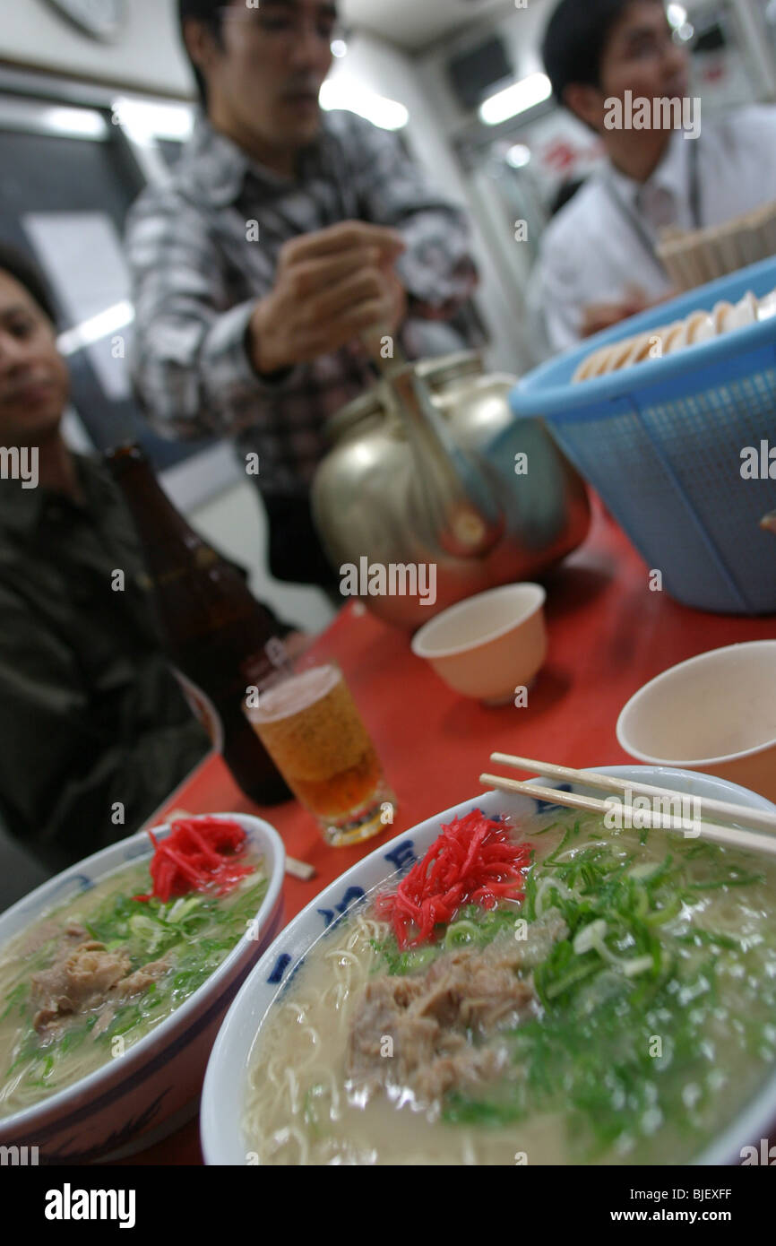 Eating ramen noodles in a ramen restaurant, a speciality of Fukuoka