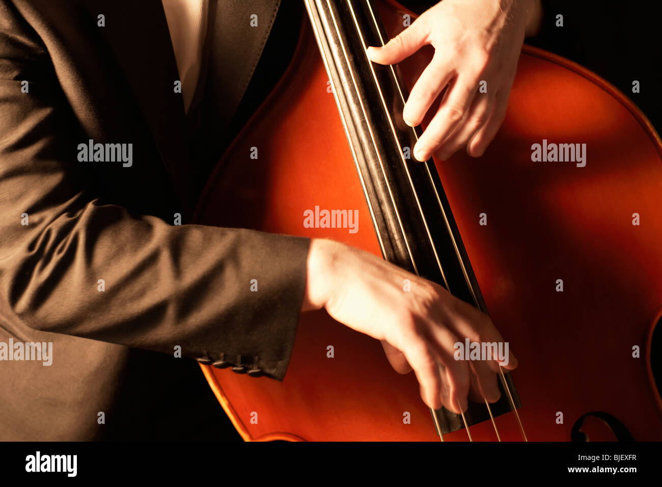 HaNds plucking fingerboard of double bass Stock Photo Alamy