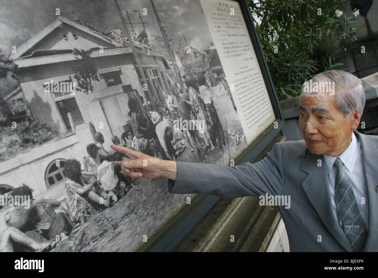 Sunao Tsuboi on Miyuki Bridge, where he was photographed 3 hours after the atomic bombing of Hiroshima. Stock Photo
