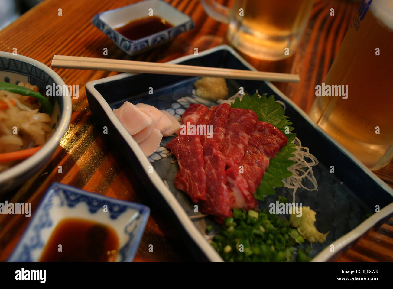 Eating raw horse meat in a restaurant, a speciality of Kyushu island