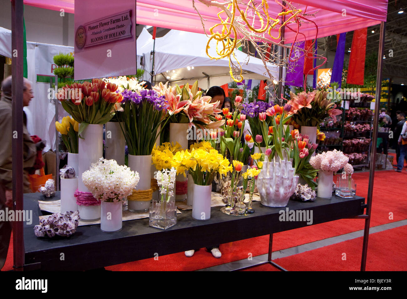 beautiful flower on table display showcase white vase Stock Photo