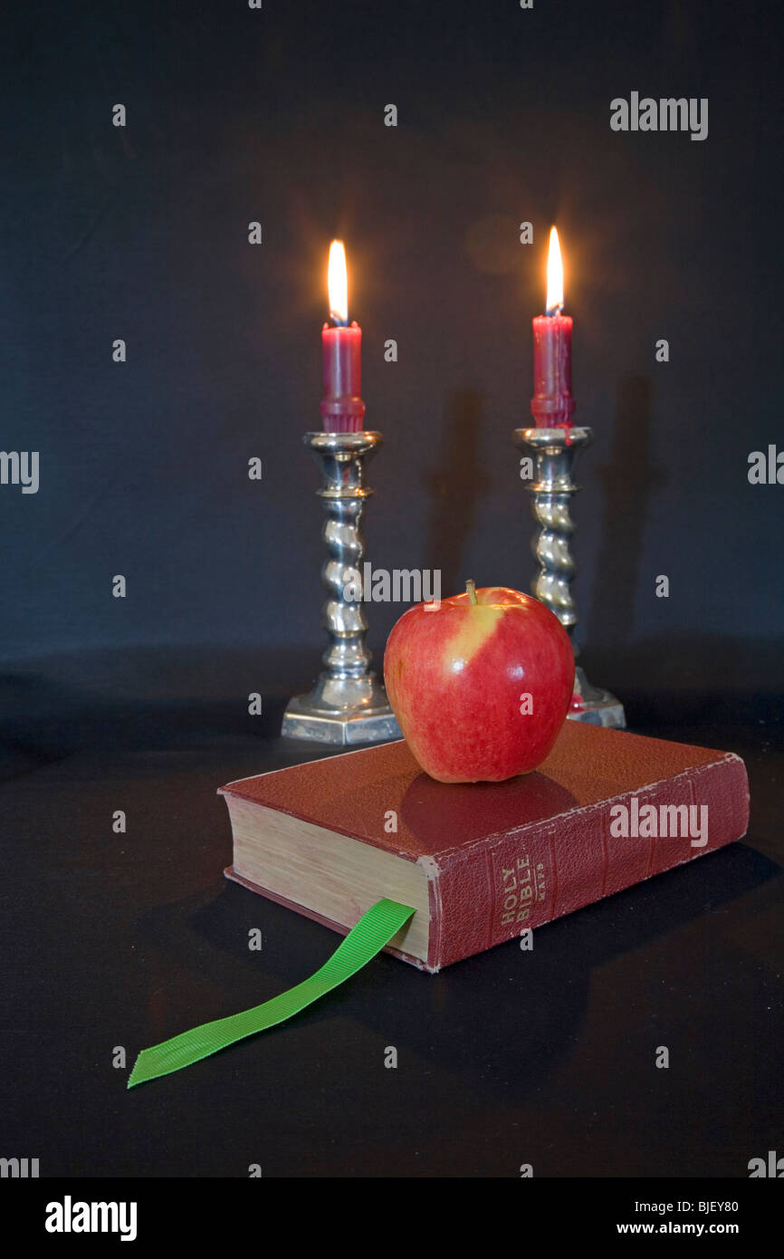 Lighted candles, reading glasses, and a good book Stock Photo Alamy