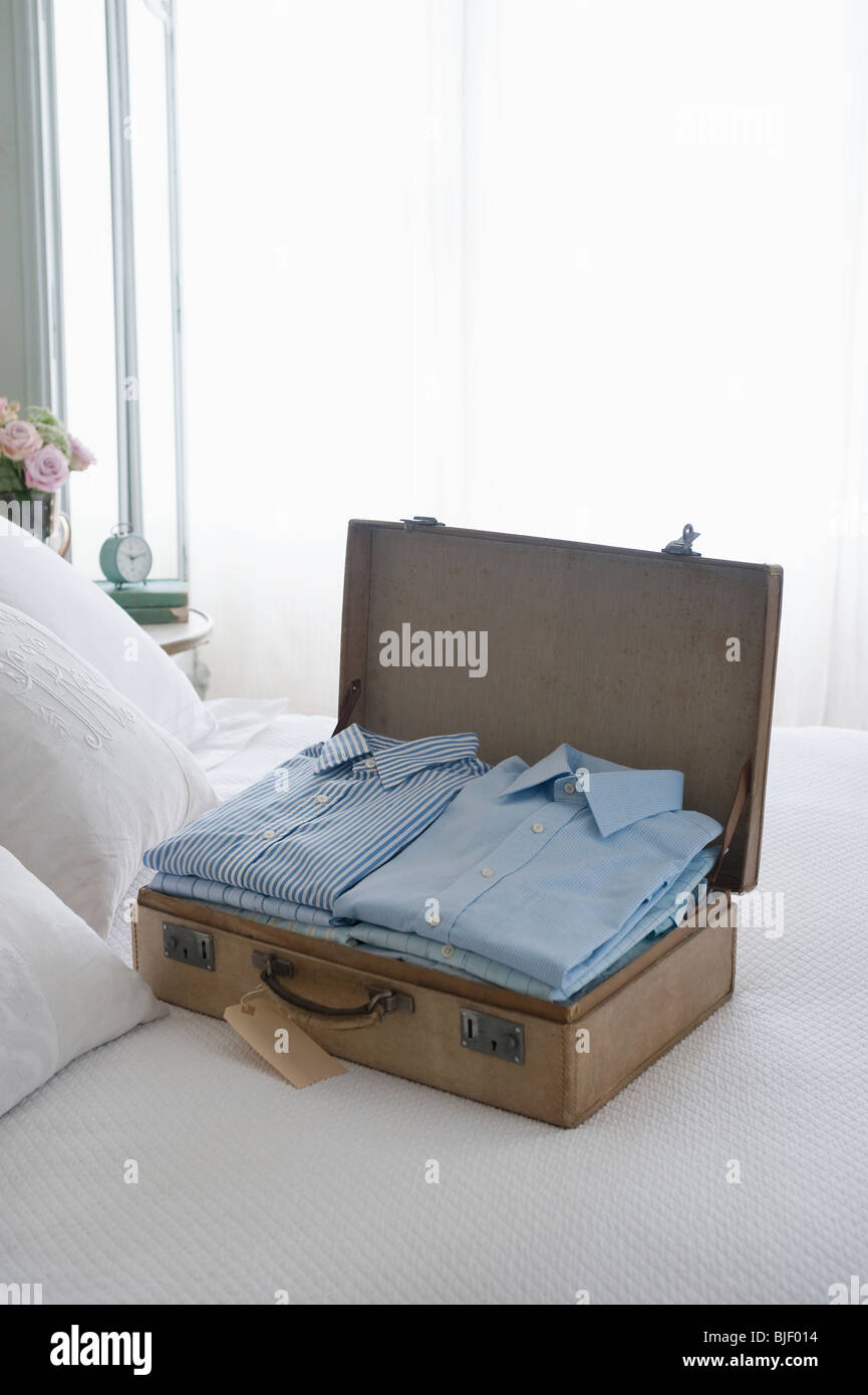 Pressed shirts in a suitcase Stock Photo