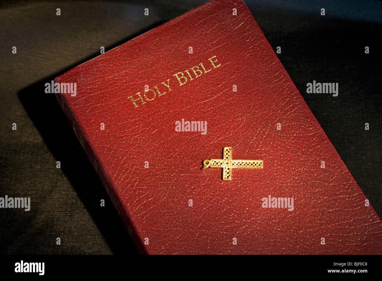 The Holy Bible, King James Version, and a gold cross Stock Photo