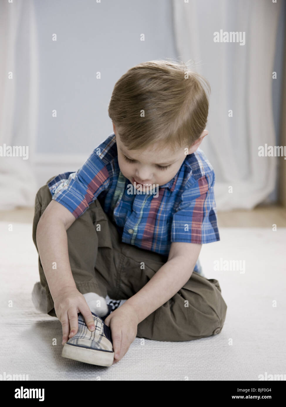 Toddler Putting On Shoes