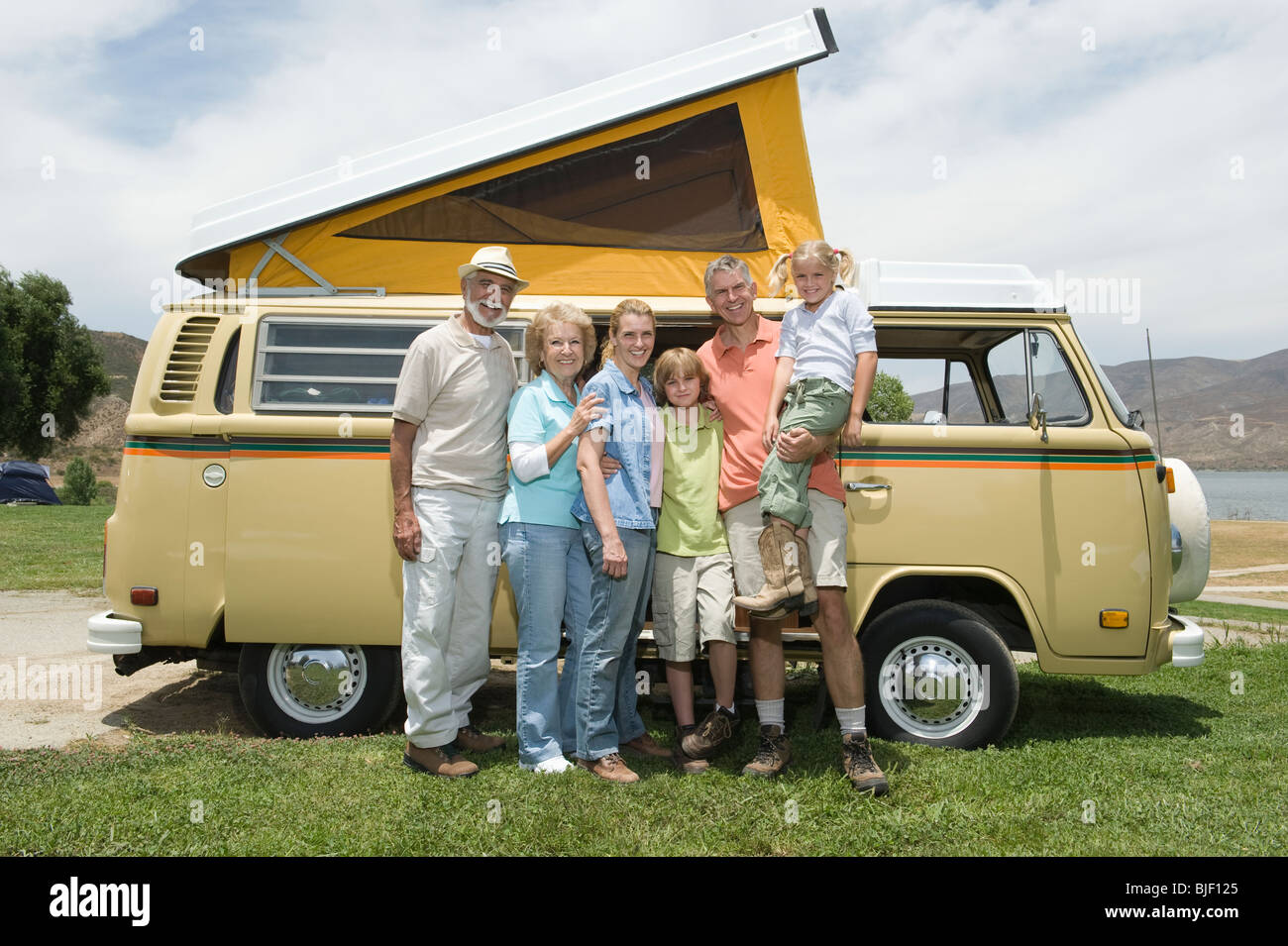 Three generational family with campervan Stock Photo - Alamy