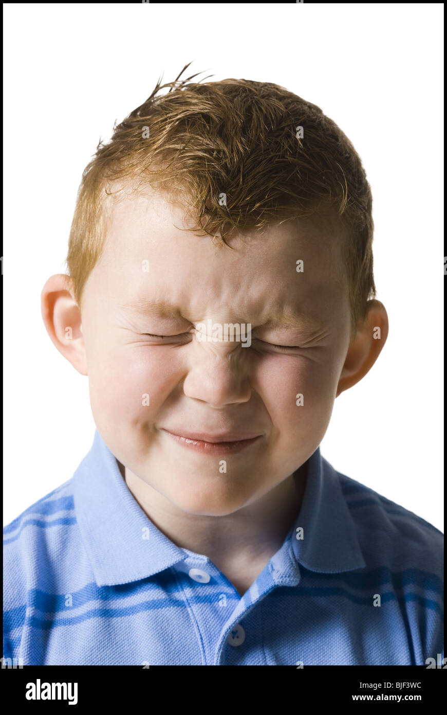 boy squinting at camera Stock Photo - Alamy